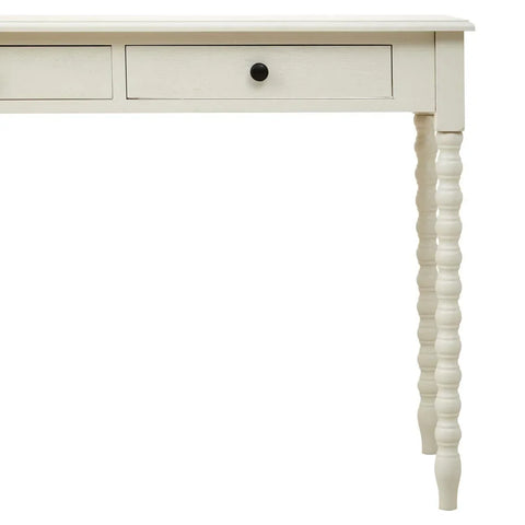 Cream wooden console table with turned legs and two drawers, partial front view