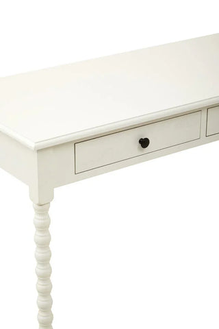 White wooden console table with turned leg and single drawer, close up of top and front
