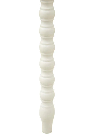White wooden furniture leg with turned spindle design, close-up view