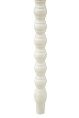 White wooden furniture leg with turned spindle design, close-up view