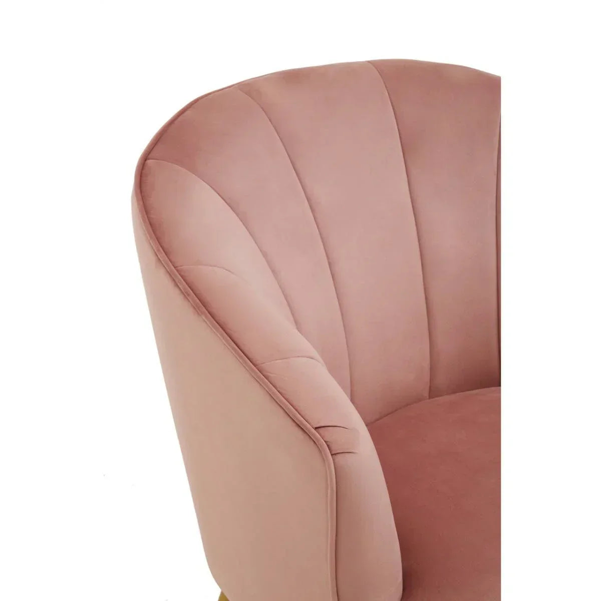 Blush pink velvet accent chair with curved back and vertical stitch detailing