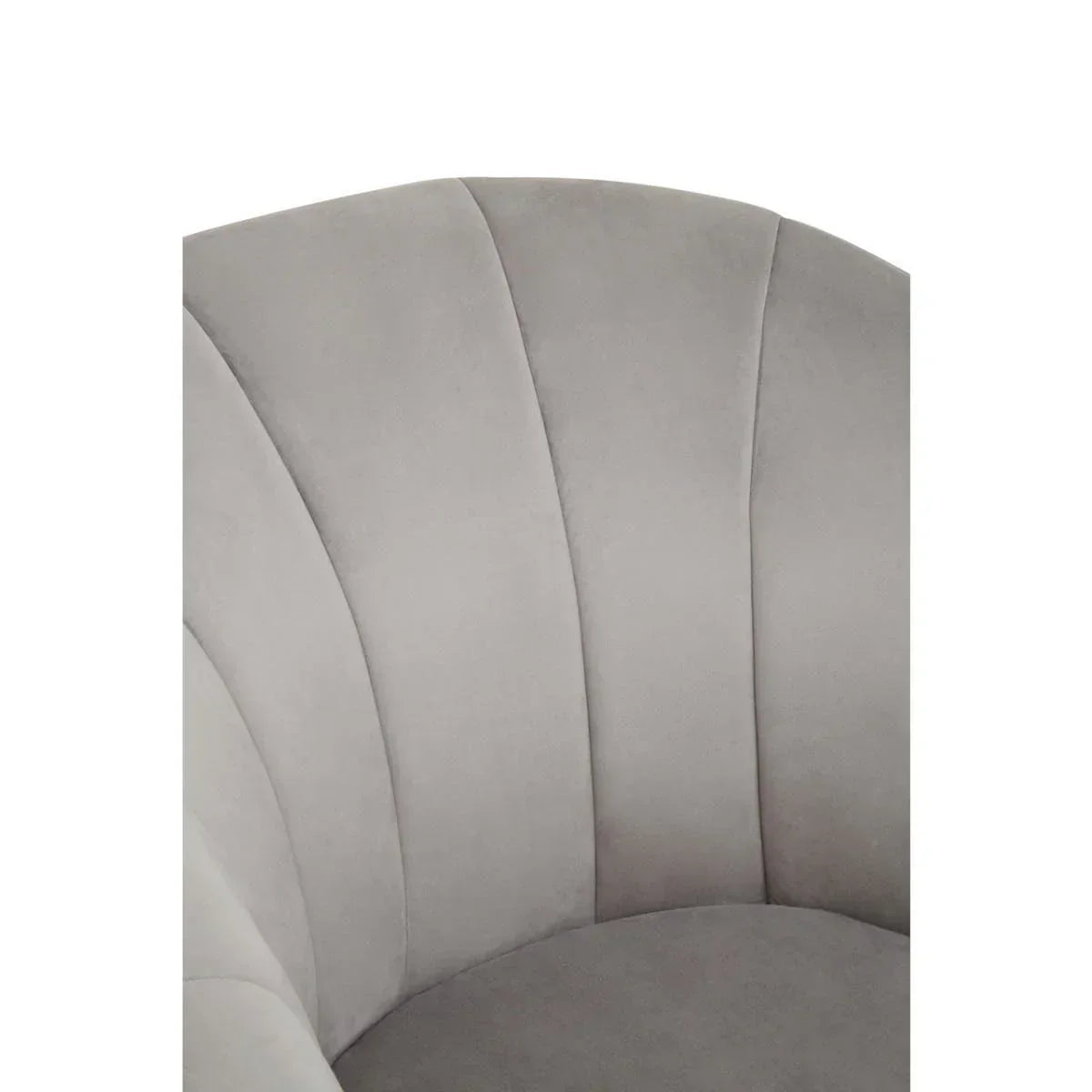 Closeup of grey velvet armchair with vertical stitched backrest