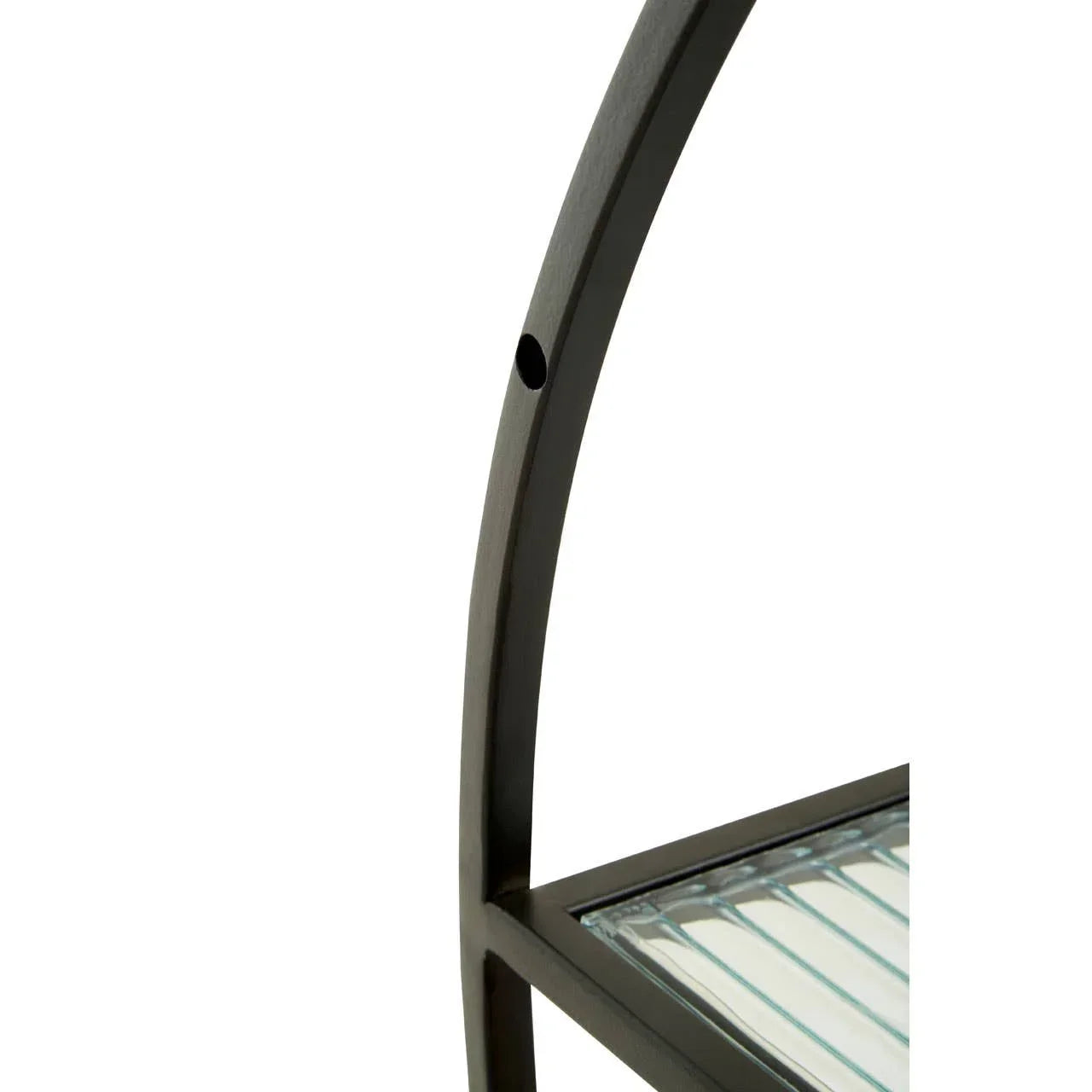 Curved metal frame with glass shelf detail from modern shelving unit
