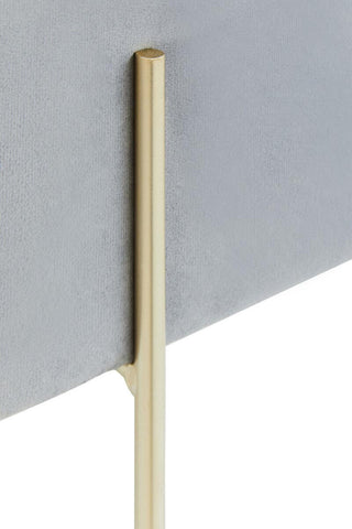Square grey velvet stool with a sleek design, featuring a soft fabric surface and a minimalist gold metal leg. The leg has a slender profile, adding a modern touch to the overall aesthetic