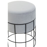 Velvet stool with a round, cushioned top in light gray, supported by a black wire cage frame. The design features a minimalist aesthetic with a sleek, modern look