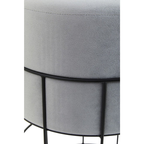 Round velvet stool in a light gray color, featuring a sleek black metal cage frame. The design showcases a smooth, plush top and a minimalist structure with four slender legs