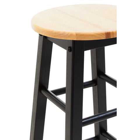Closeup of wooden bar stool with round light wood seat and black legs