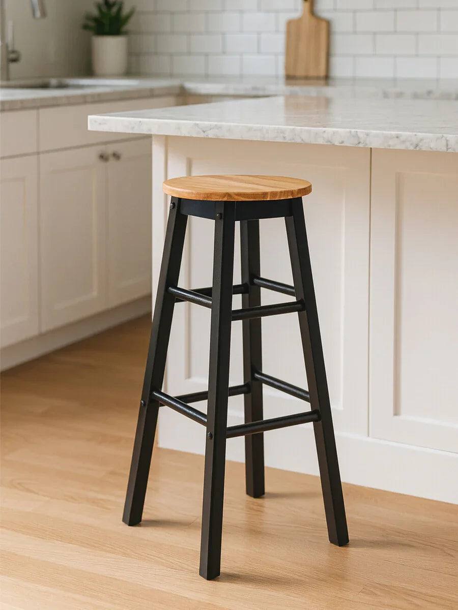 Wood and black metal bar stool beside marble kitchen island