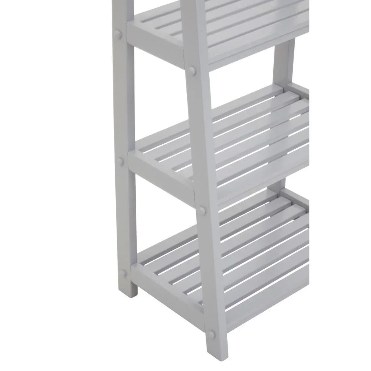 Close-up of white wooden slatted shelving unit with multiple tiers and vertical supports