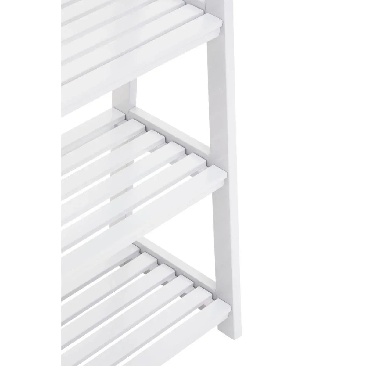 Closeup of white wooden shelving unit with slatted shelves and vertical frame