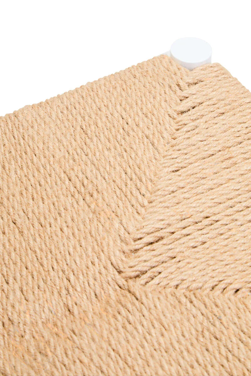 Close-up of woven rope seat detail with natural jute texture and white corner foot