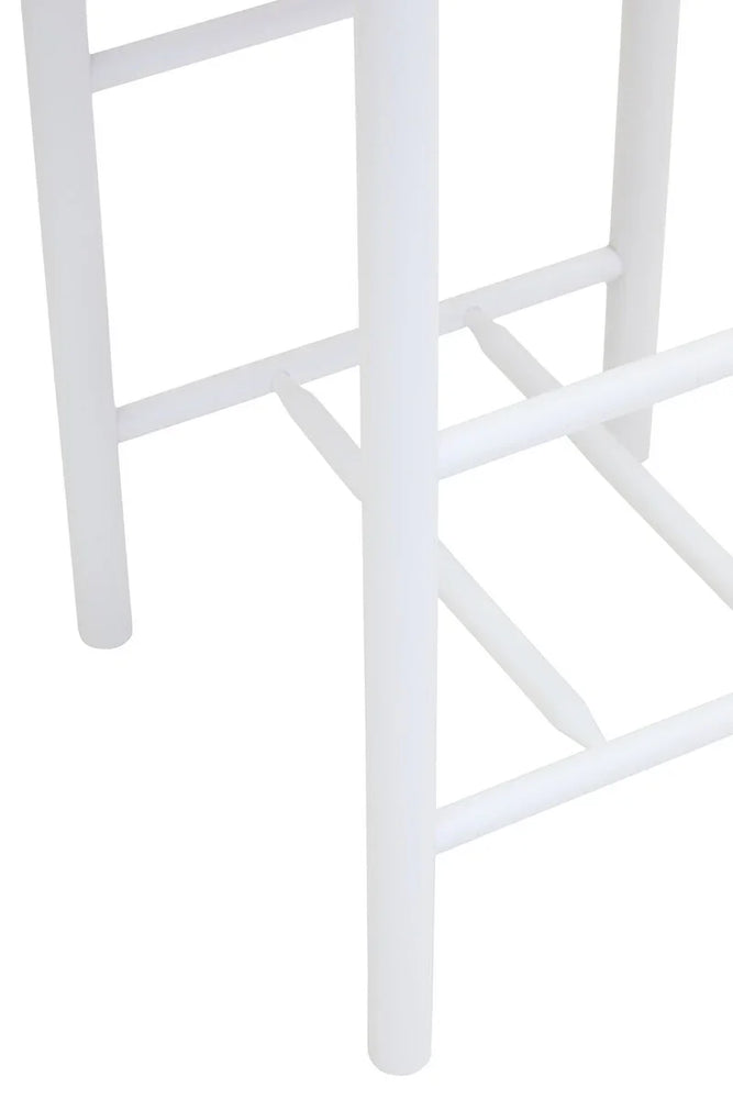White wooden stool legs and footrest close-up