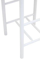 White wooden stool legs and footrest close-up