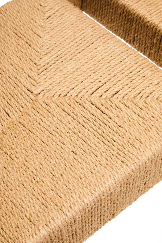 Closeup of woven rope bench seat with chevron pattern and natural fiber texture