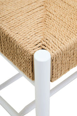 Close view of woven rope seat on white metal chair