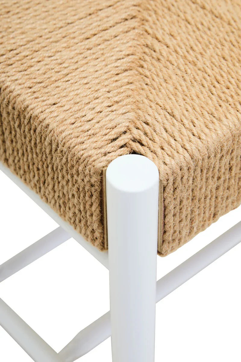 Close view of woven rope seat on white metal chair