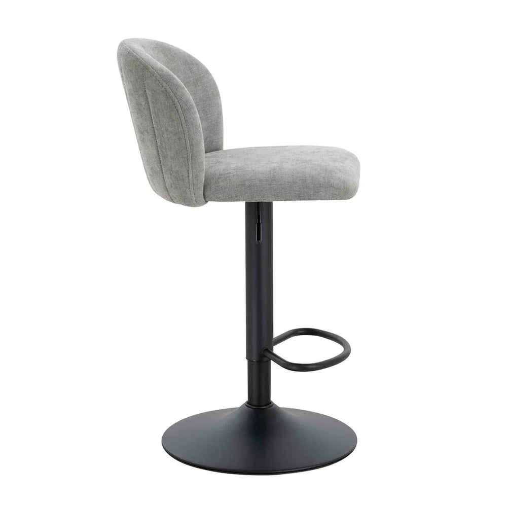 Grey fabric bar stool with curved backrest and black metal base, side profile view