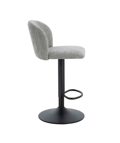 Grey fabric bar stool with curved backrest and black metal base, side profile view