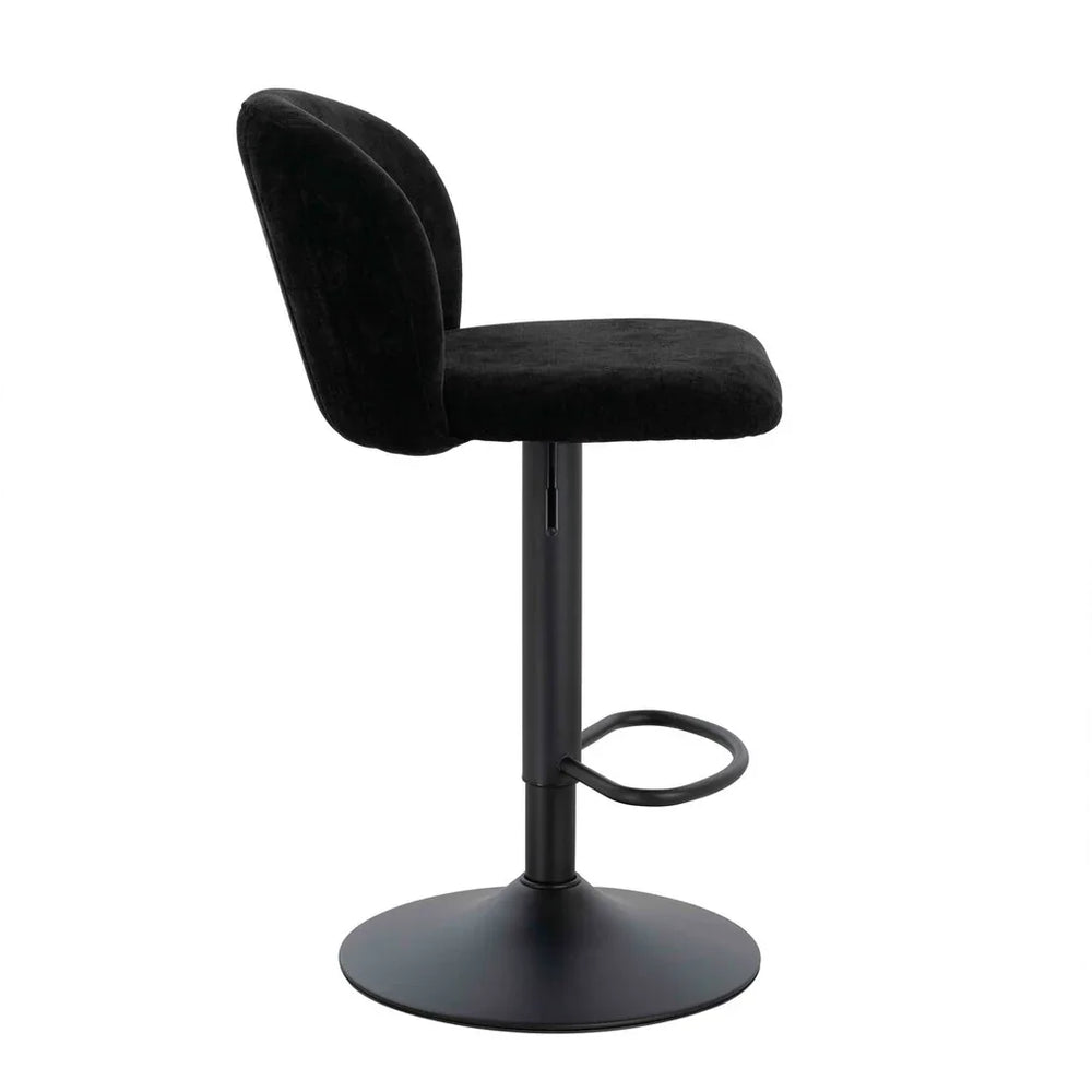 Black velvet bar stool with curved backrest and metal base, side profile view