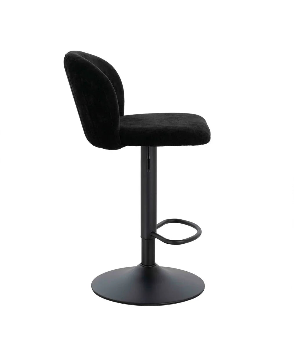 Black velvet bar stool with curved backrest and metal base, side profile view