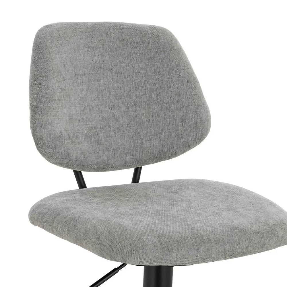 Grey fabric dining chair with cushioned seat and backrest on black metal legs
