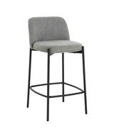 Grey fabric bar stool with cushioned seat, black metal legs and low curved backrest
