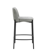 Grey fabric bar stool with black metal legs, side view