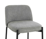 Grey fabric dining chair with cushioned seat and black metal legs, front angle view