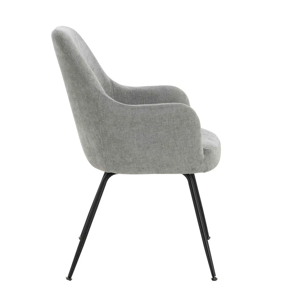 Grey fabric dining chair with curved back and black metal legs, side profile view