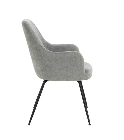 Grey fabric dining chair with curved back and black metal legs, side profile view