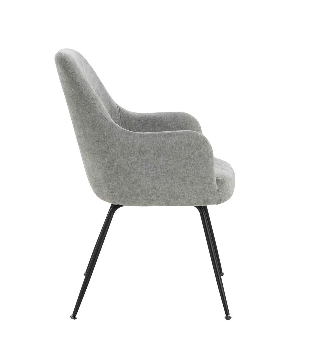 Grey fabric dining chair with curved back and black metal legs, side profile view