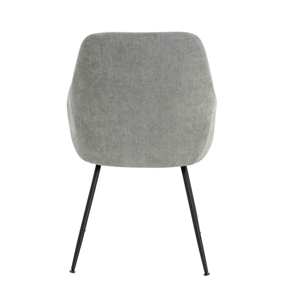 Rear view of grey fabric dining chair with black tapered metal legs