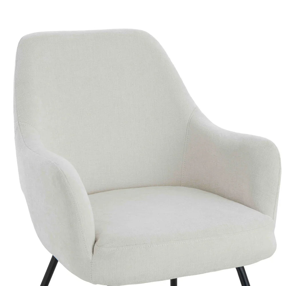 Cream fabric accent chair with curved backrest and black metal legs