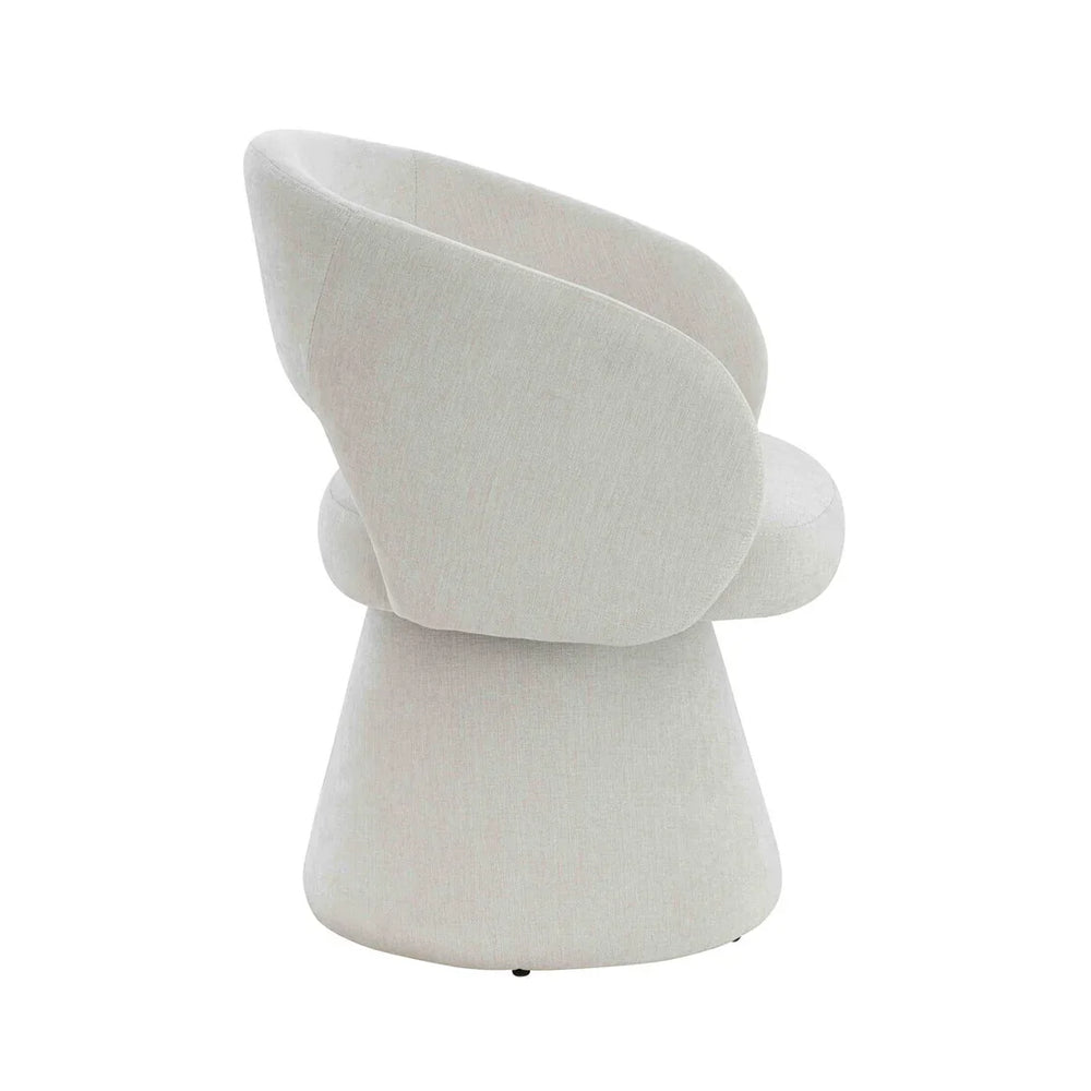 Side view of modern cream fabric accent chair with curved back and flared base