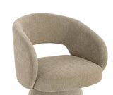 Beige fabric accent chair with curved backrest and wide cushioned seat, side angle view