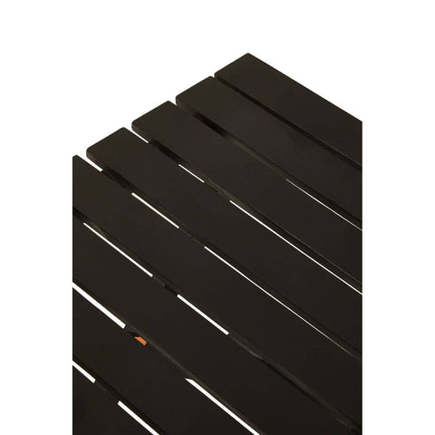 Black wood folding table with a slatted top design, showcasing a sleek and modern aesthetic. The table is partially folded, highlighting its compact form and versatility for space-saving