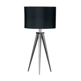 Black tripod table lamp with metal legs and round fabric shade
