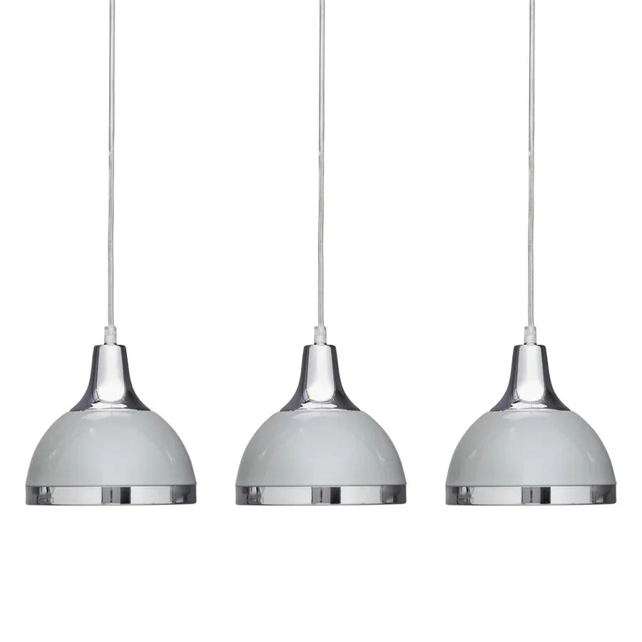 Set of three chrome pendant lights with white domed shades, suspended on cables
