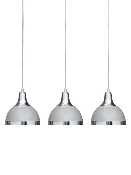 Set of three chrome pendant lights with white domed shades, suspended on cables