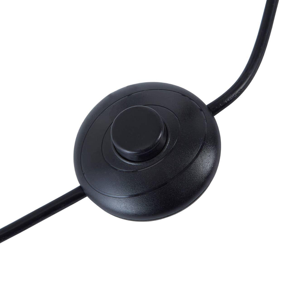Black floor lamp foot switch with attached cable, close-up on white background