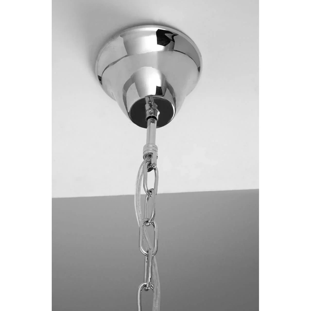Chrome ceiling light fitting with metal chain and cable detail, close-up view