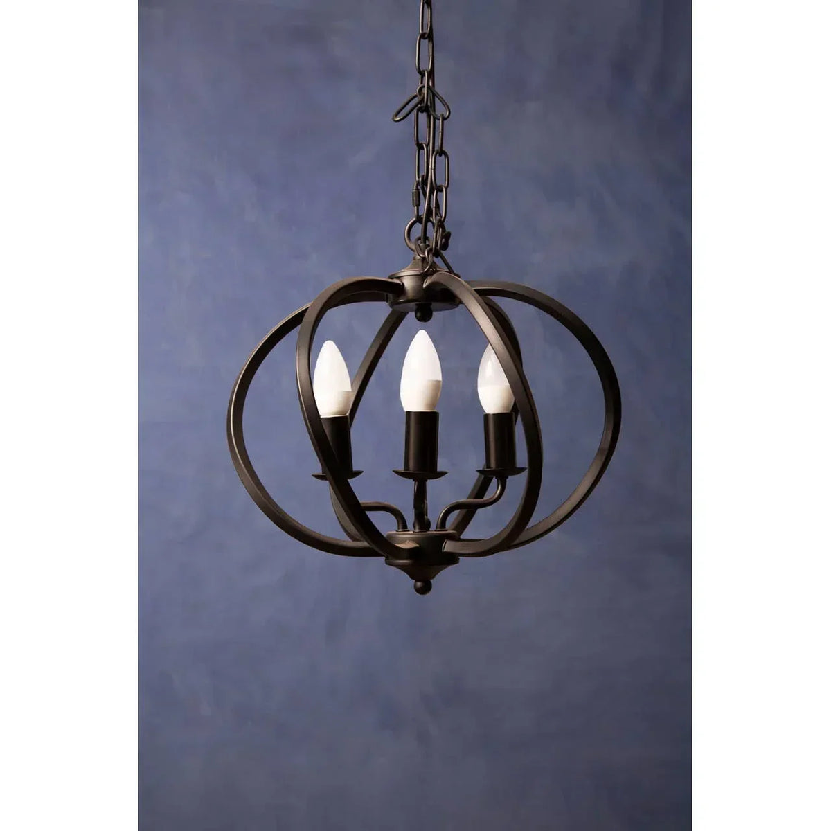 Black metal orb chandelier with three candle-style light bulbs and chain hanging