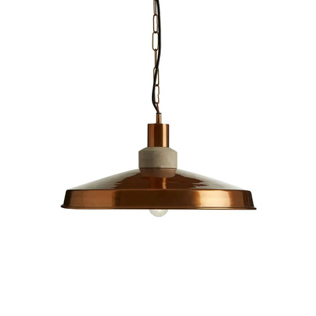 Copper pendant light with wide metal shade and concrete detail, hanging on black chain