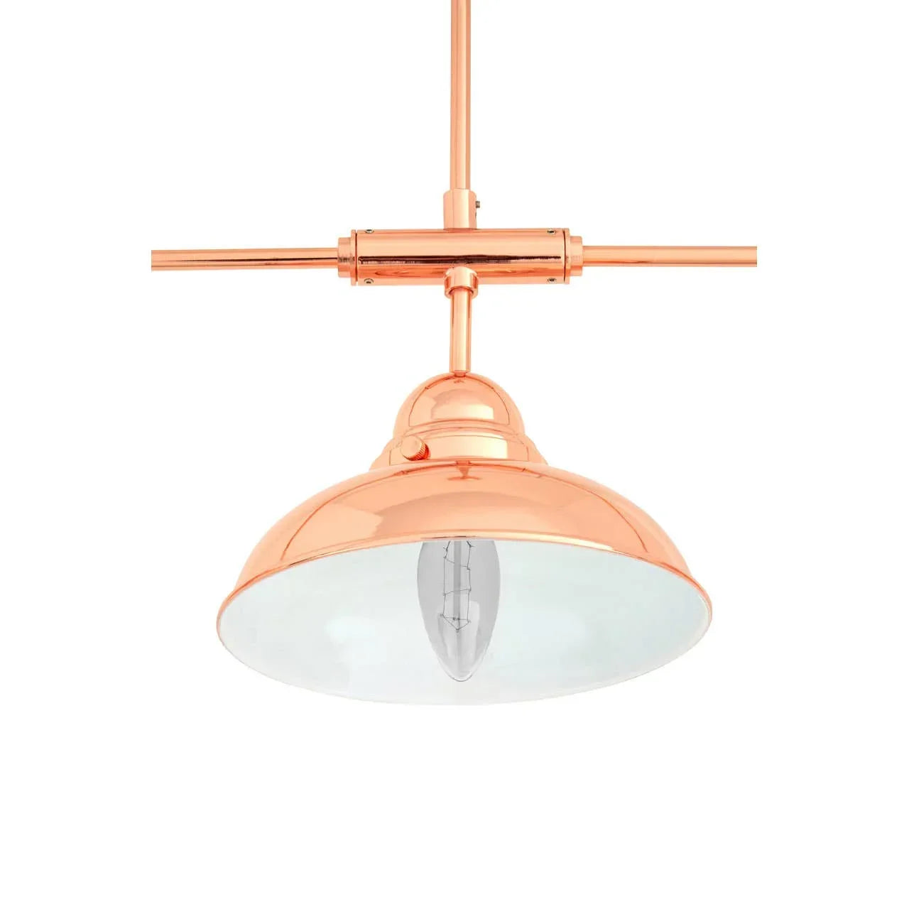 Copper pendant light with wide dome shade and exposed bulb, shown from below