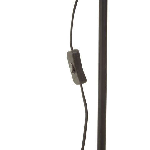 Black floor lamp power cable with inline switch and metal pole close-up