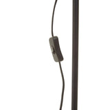 Black floor lamp power cable with inline switch and metal pole close-up