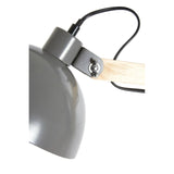 Grey metal desk lamp with wooden arm and black cord, close-up side view