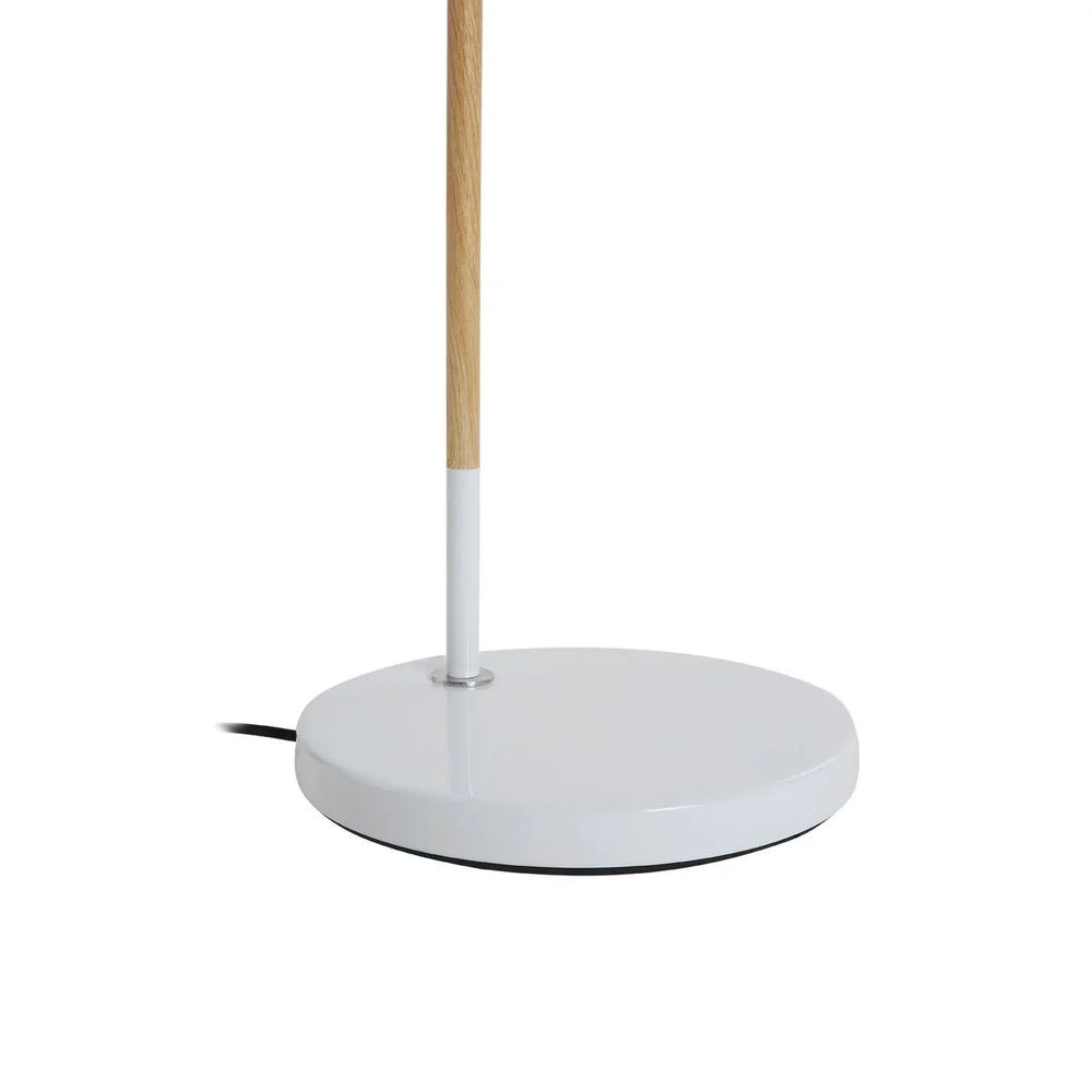 White round lamp base with wood accent and black cord on white background