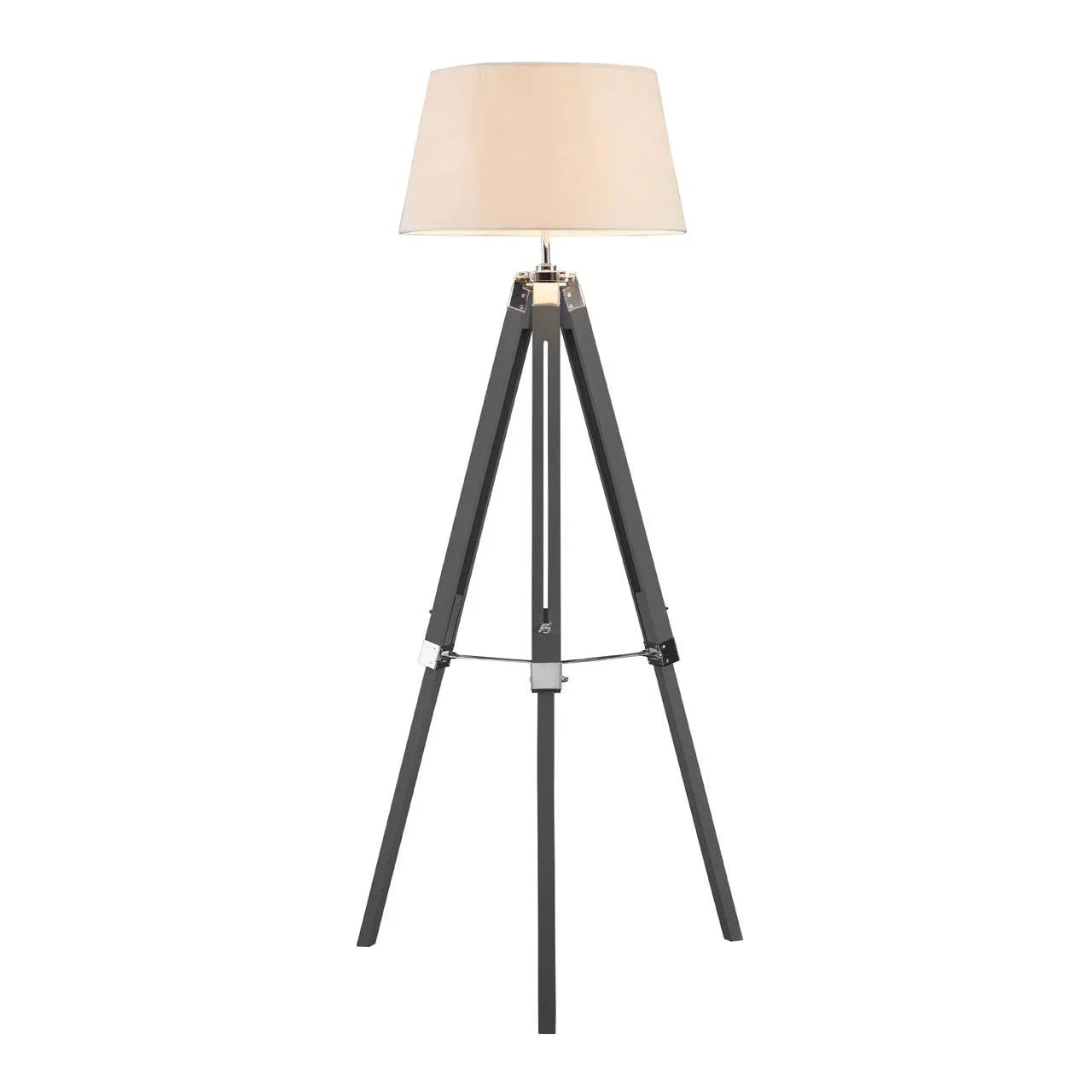 Black tripod floor lamp with beige fabric shade and metal accents
