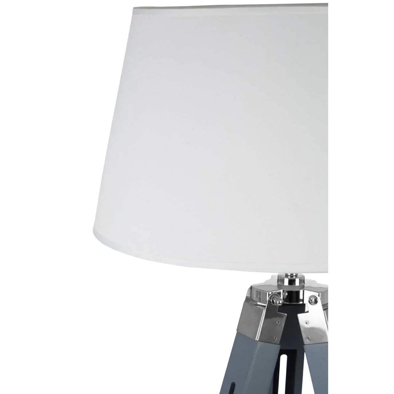 White tripod table lamp with wooden legs and chrome detail close-up
